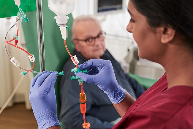 Oncology: nurse and cancer patient in chemotherapy