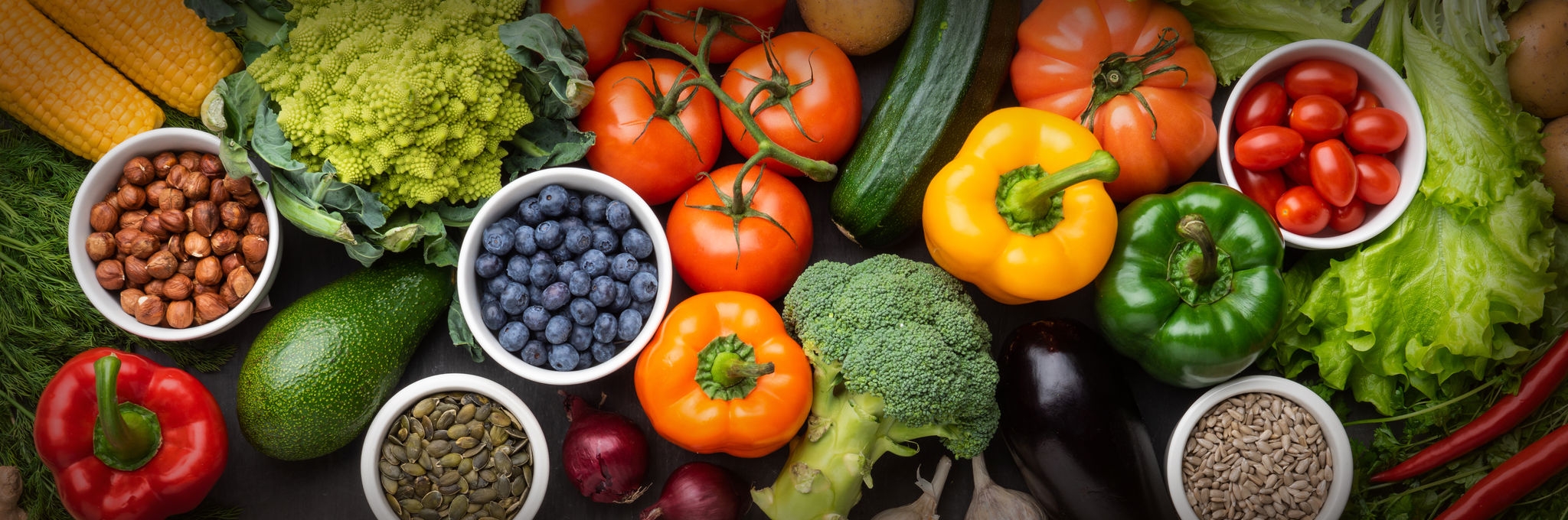 Healthy eating ingredients: fresh vegetables, fruits and superfood. Nutrition, diet, vegan food concept. Concrete background